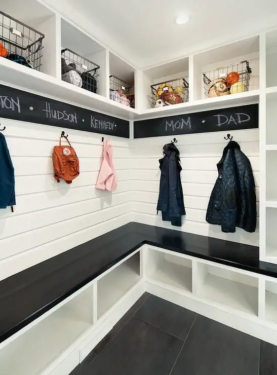 This is a gorgeous DIY mudroom (or foyer) idea - love the chalkboard wrapping around it.  The cubbies are great for keeping things organized - I'd throw some pretty baskets in the cubbies at the bottom to declutter and keep it looking neat and tidy