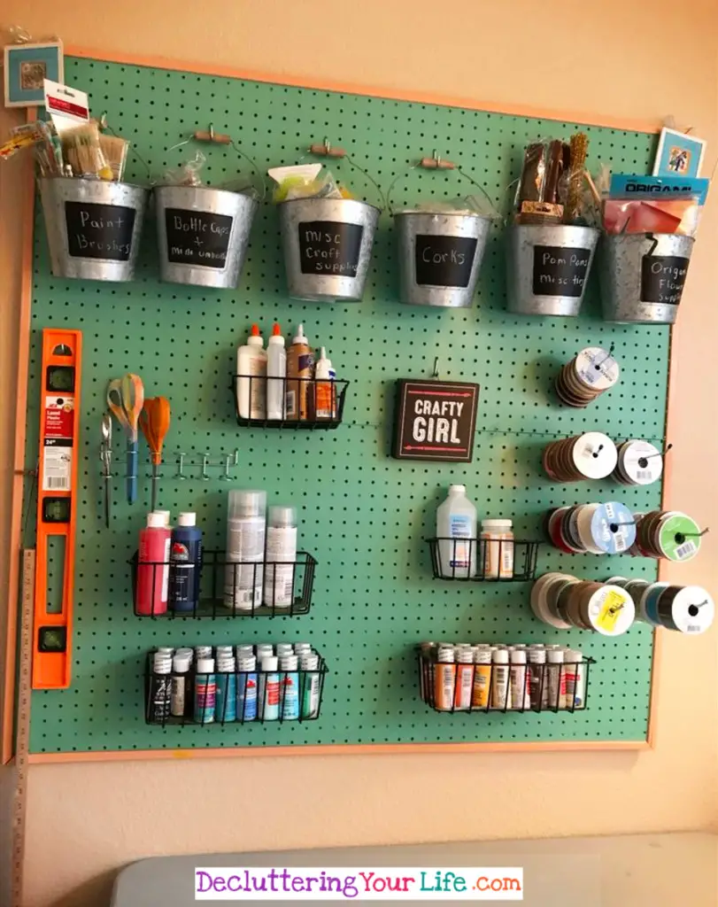Craft Room Wall - This simple pegboard makes it SO easy to keep my craft supplies organized - Craft Room Organizing Ideas #gettingorganized #goals #organizationideasforthehome