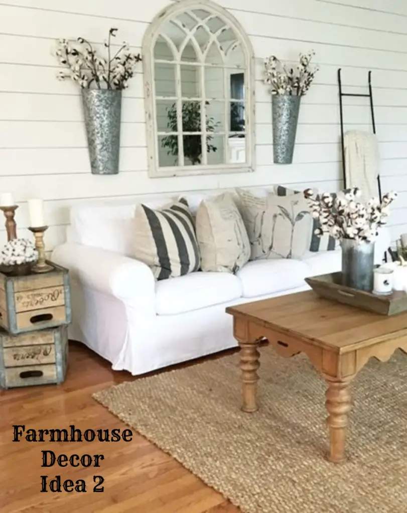 Farmhouse living room decorating idea - love the white couch and shiplap walls - Clutter-free Farmhouse Decor Ideas #farmhousedecorating #rusticfarmhouse #diydecor #homedecorideas #diyhomedecor #farmhousestyle #farmhousedecorideas #decoratingideas #kitchenideas #livingroomideas #bedroomideas #bathroomideas #laundryroomideas