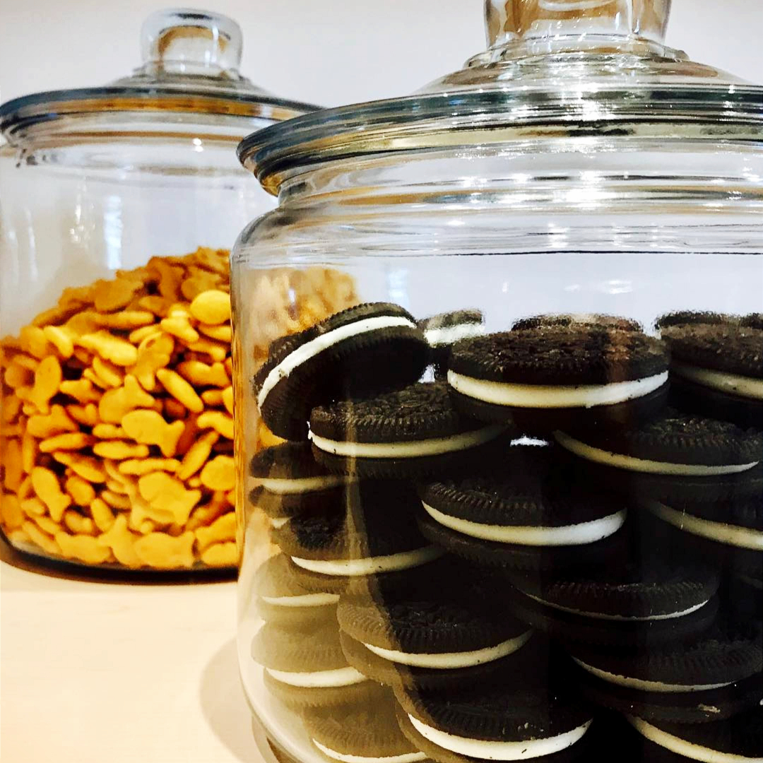 Organizing your pantry on a budget -  Try taking boxes of snacks OUT of the pantry and display them on your kitchen counter in pretty clear glass cookie jars