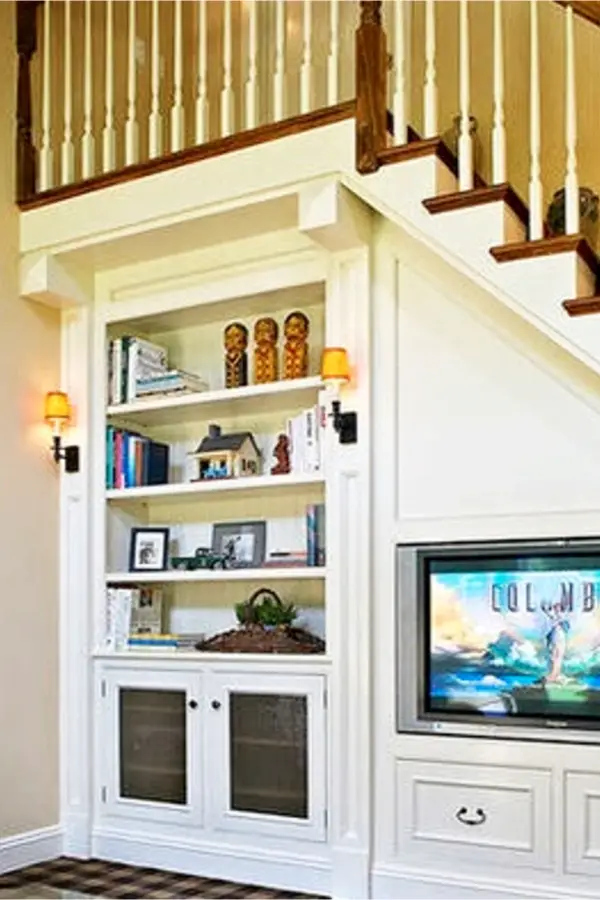 Under stair storage ideas - bookshelves and entertainments center under stairs