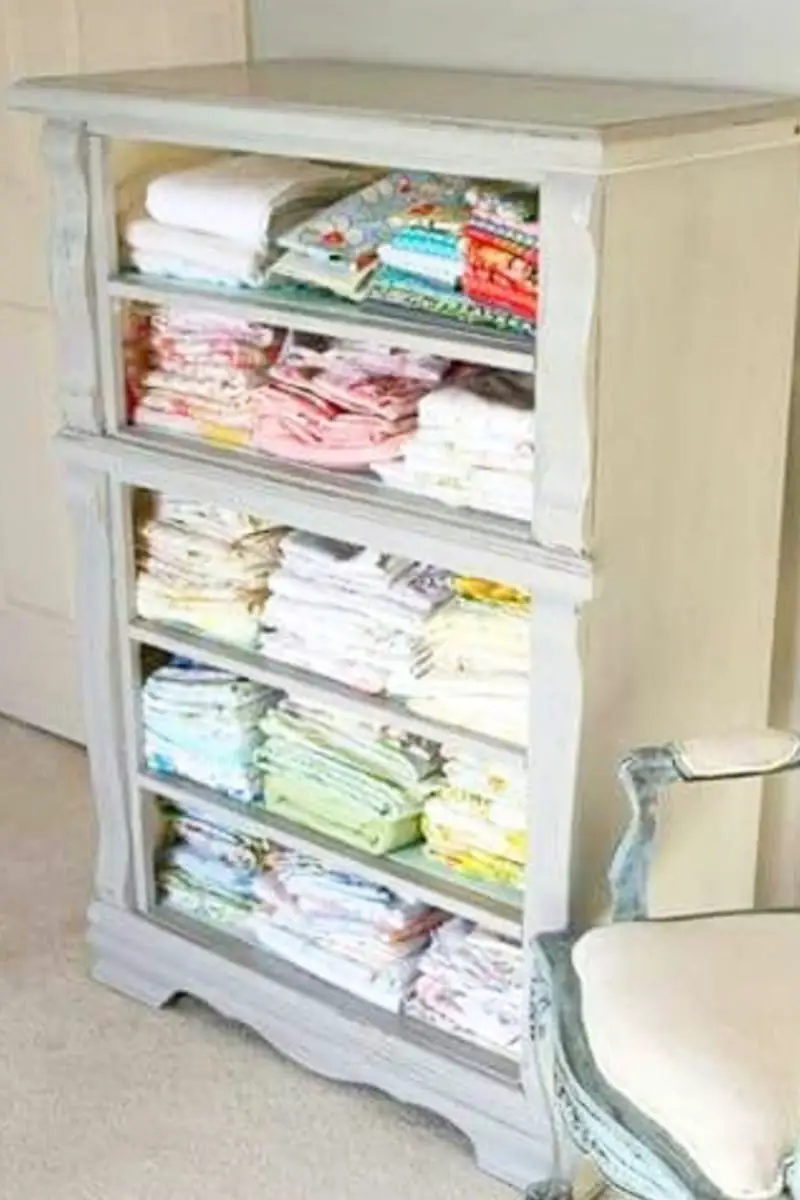 repurposed dresser without drawers for towel and linen storage