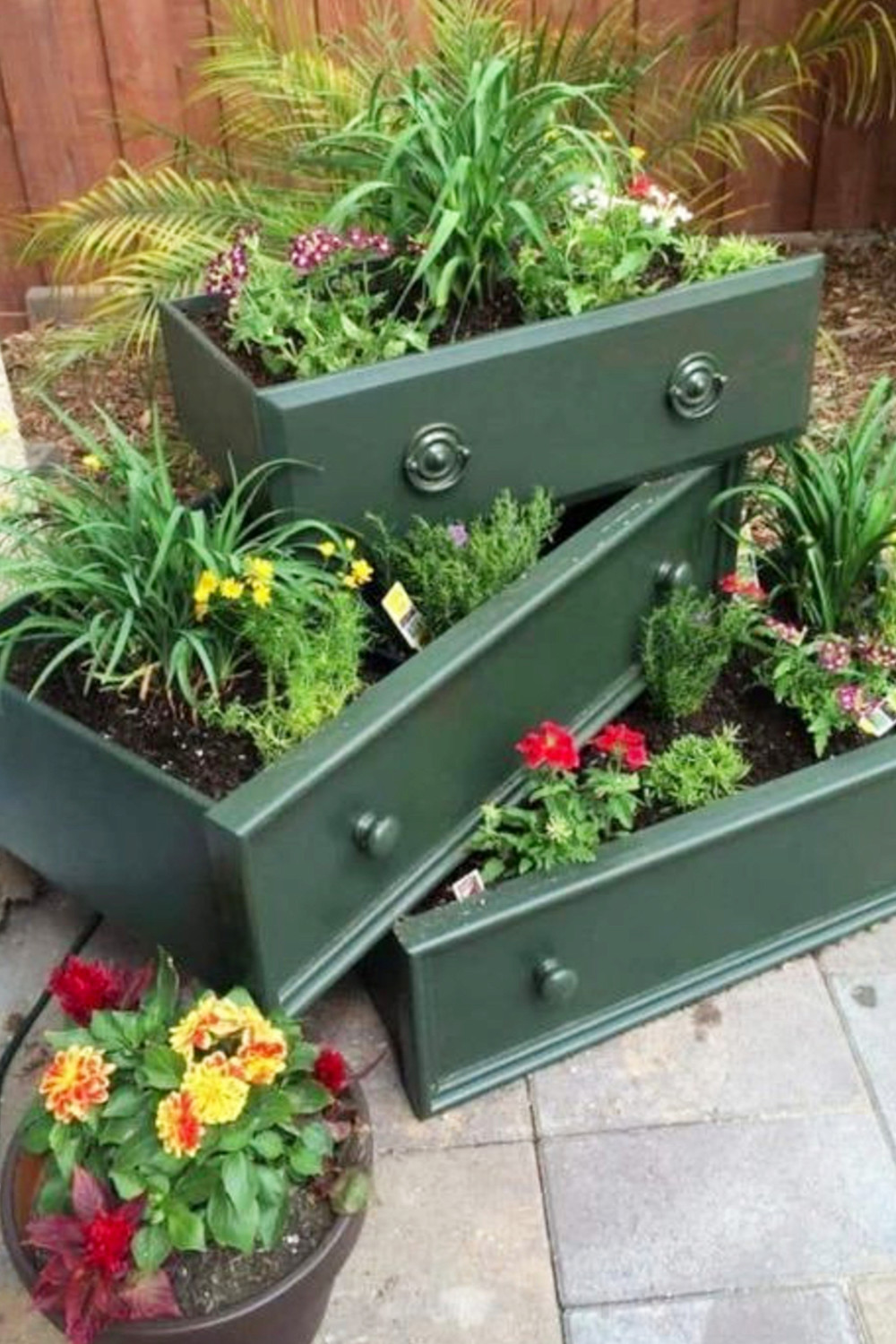 repurposed dresser drawers in flower garden planters for patio gardening or flower beds