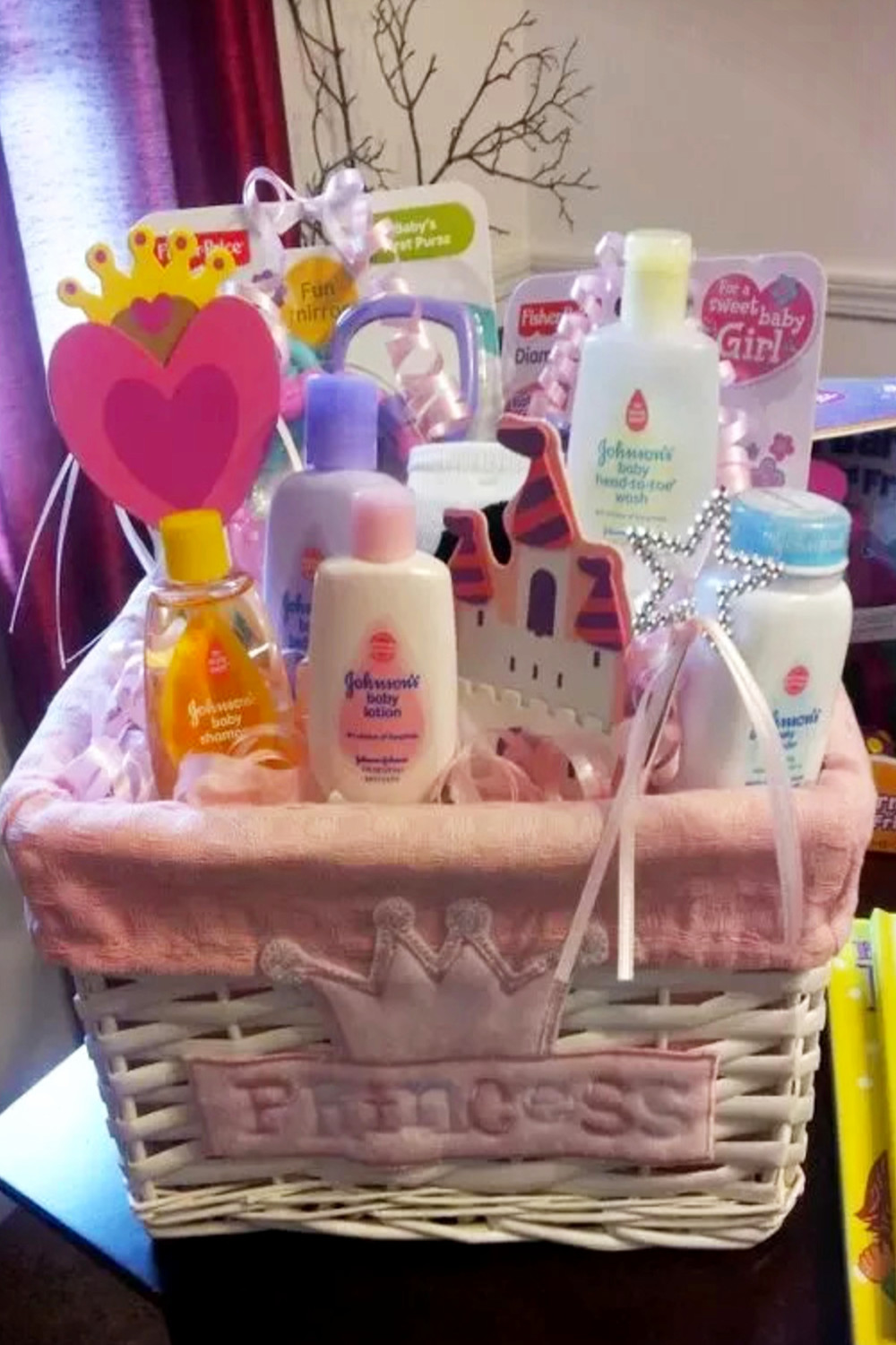 White wicker baby shower gift basket for girl